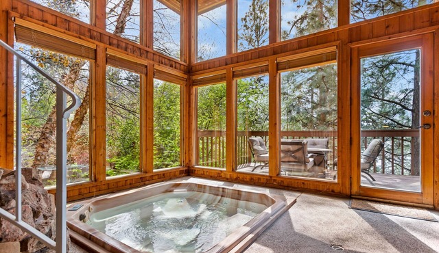 Unique lakefront hideaway with four decks, dock, private hot tub & wood stove