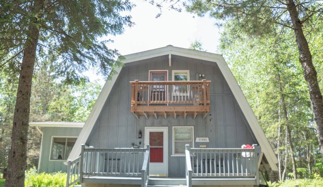 Unique modified A-frame cabin with loft, sandy lakefront, and amenities of home.