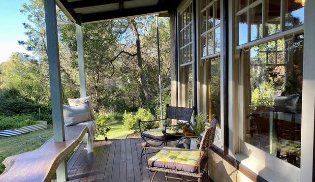 Unique Mud-Brick Cottage, bush garden with a flowing creek