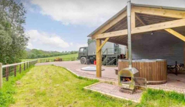 Unique stay in your very own army truck. Sleeps 4. Hot tub. Tranquil setting.