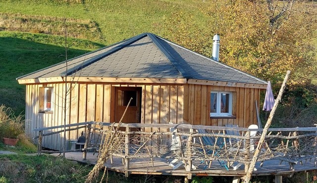 Unique wooden hut with mountain panorama