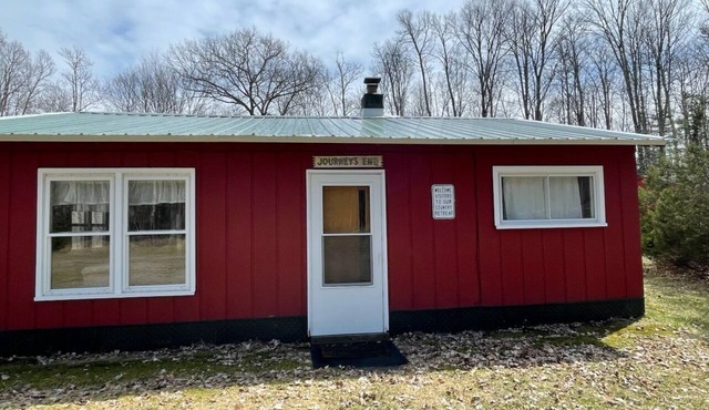 Unplug from it all at a lovely 2-bedroom cabin nestled in the woods!