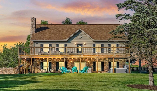 Unwind under the stars by the crackling campfire or indulge in relaxation in the bubbling hot tub. Embrace the essence of togetherness and create unforgettable memories in this inviting haven.