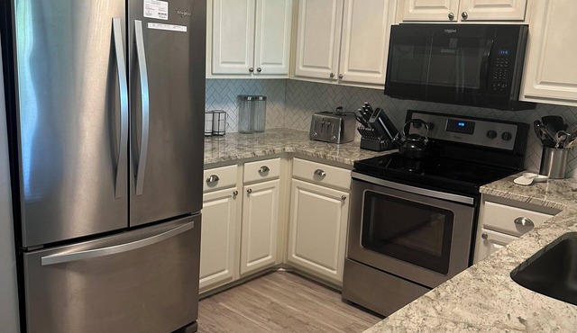 Updated 3 bedroom 2 full bath condo on True Blue's nGolf Course with water view.