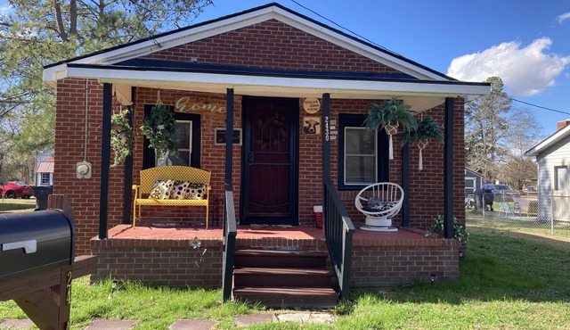 Updated bungalow with screened in porch in rear.
