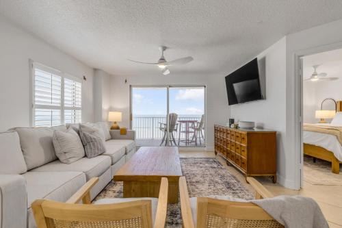 Updated direct oceanfront corner 2/2 with stunning beach views, a heated pool, and parking garage