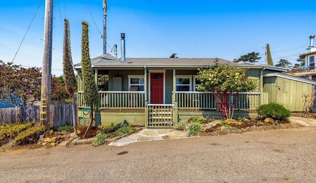 Updated, dog-friendly cottage with bay views, wraparound deck & EV charger