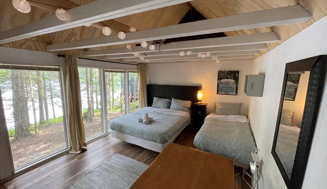 Updated historic log cabin on the lake, w/amenities enough for 2 families