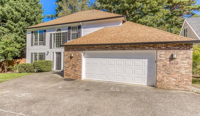 Updated home next to a park with fenced yard, deck, grill, & W/D