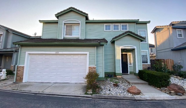 Updated home with garage parking near shopping, parks, and freeways