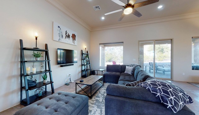 Updated home with mountain views, a private patio, grill, EV charger, W/D, & AC