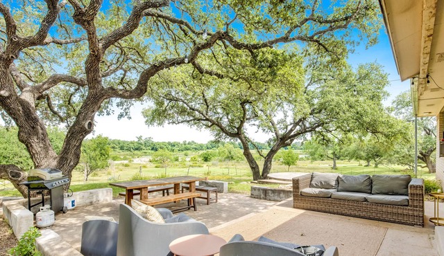 Updated riverfront home with great view, patio, grill, & serene location