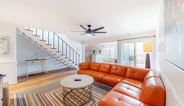 Updated townhome with grassy yard, grill, open layout, W/D, & AC