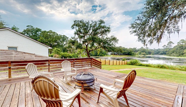 Updated waterfront home with spacious outdoor living area, gaming room