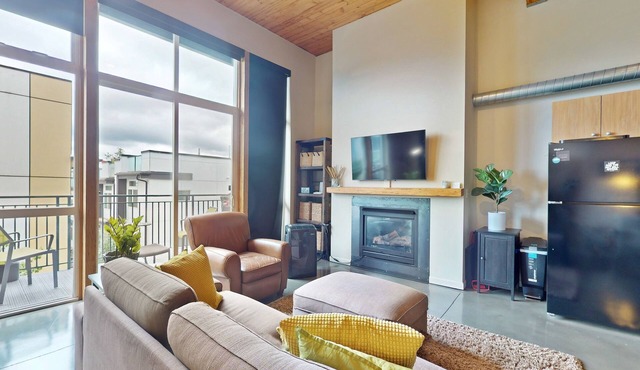 Upscale condo with reserved parking, balcony, & sleek kitchen - walk to parks