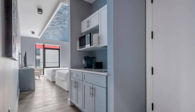 Upscale Double Queen Suite | Mott Haven | Fitness Center | Free WiFi