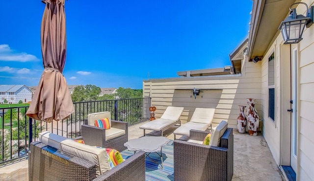 Upscale four-story townhome next to park with elevator, rooftop terrace, & WiFi