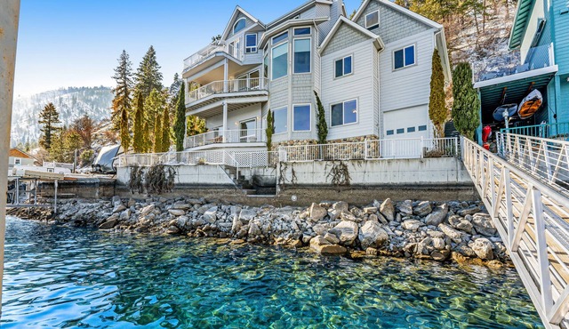 Upscale lakefront house with stunning views & dock spacious interior with fireplace