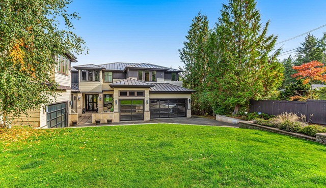 Upscale waterfront estate with private dock, fireplace, & gourmet kitchen