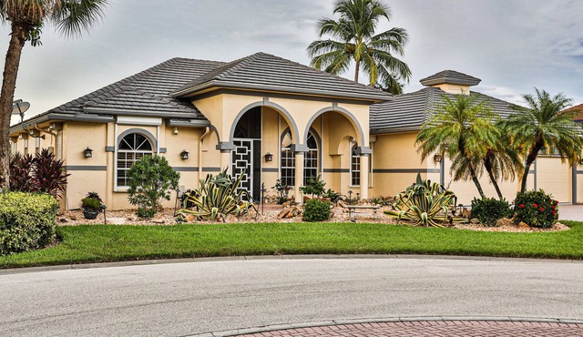 Upscale waterfront home with private dock, saltwater pool, lanai, grill, & W/D