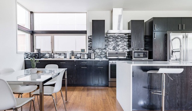 Urban Architectural Retreat with Rooftop Deck & Fireplace