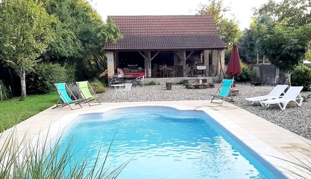 Vacation apartment "Grenier" in a former farmhouse with pool