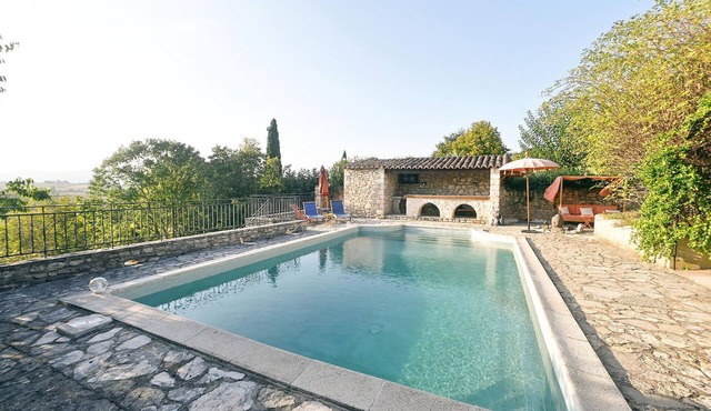 Very pretty stone village house with tasteful furnishings and communal pool.
