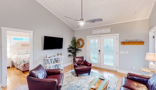 Vibrant beach-themed stay with balconies, enclosed yard, extra kitchenette, & AC