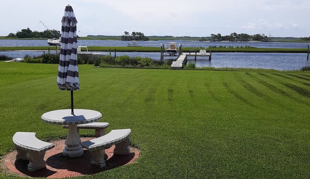 View of intracoastal waterway with private dock and boat lift.