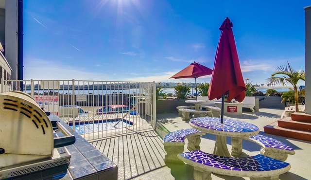 View of the water, steps from the beach, bikes and other toys included.