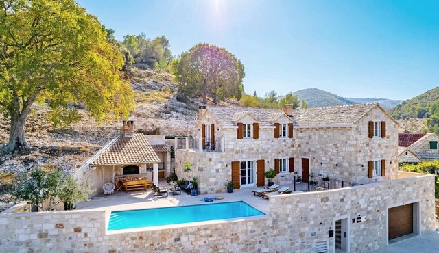 Villa Ani! Traditional and luxurious 4-bedroom villa with heated pool and sea views.