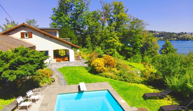 Villa directly at the lake with private pool, own beach and boathouse