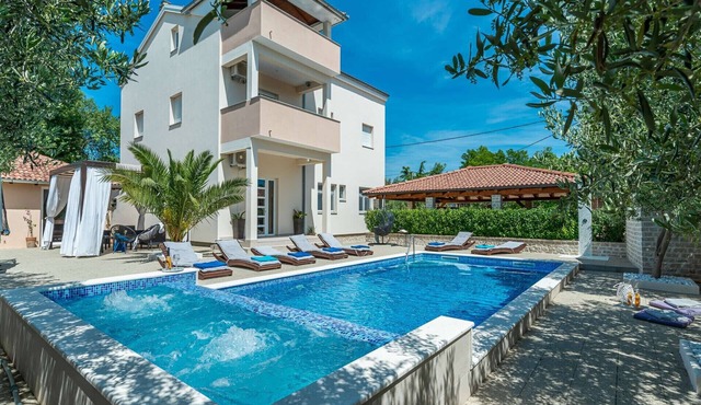 Villa Ines surrounded by vineyards and olive trees