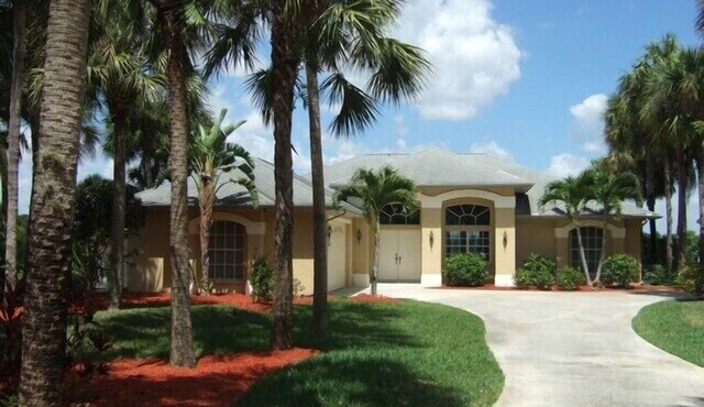 Villa surrounded by palm trees with solar heated pool for 4 people