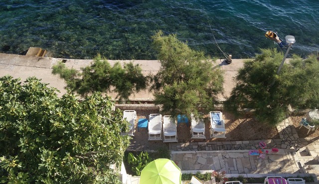 Villa Vedran apartment Vedran B with sun beds facing the sea