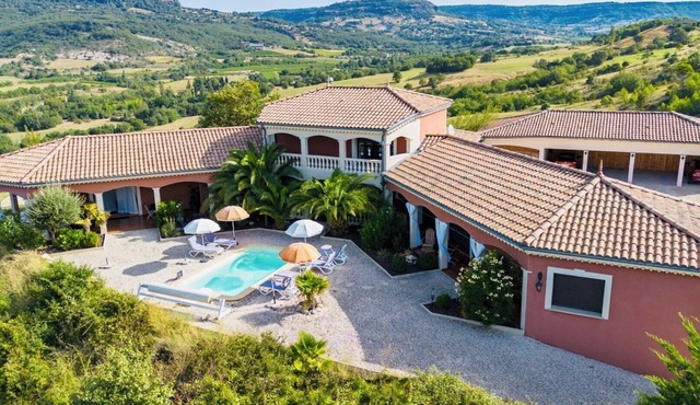 Villa with a pool and spa offering a spectacular view.