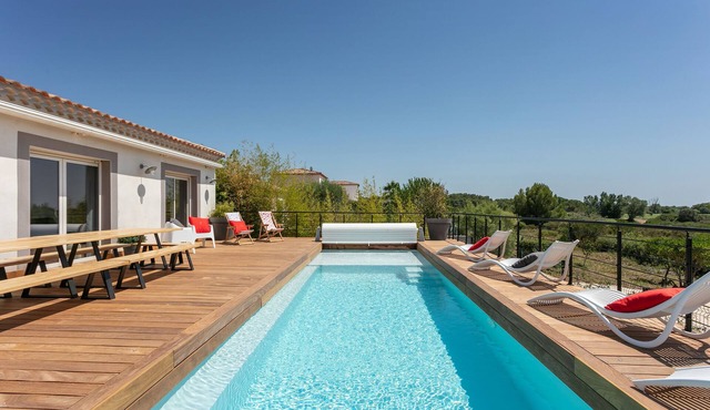 villa with pool facing Saint Thomas golf course