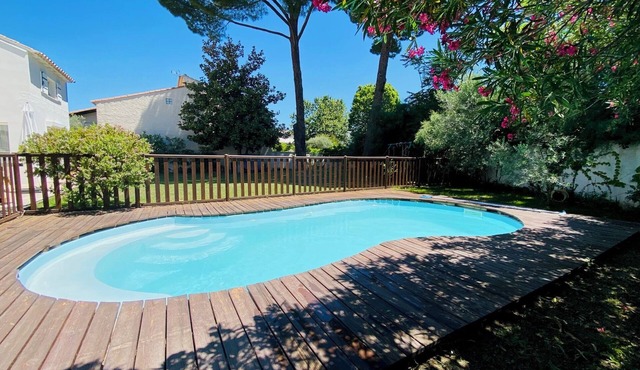 Villa with pool between golf course and beach