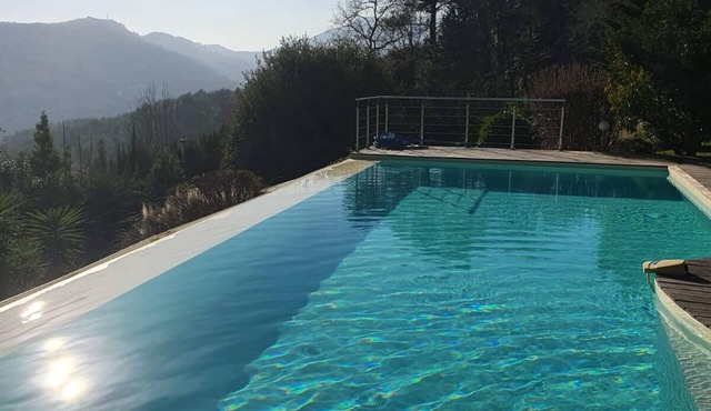 Villa with salty infinity pool and view over hills on French Riviera