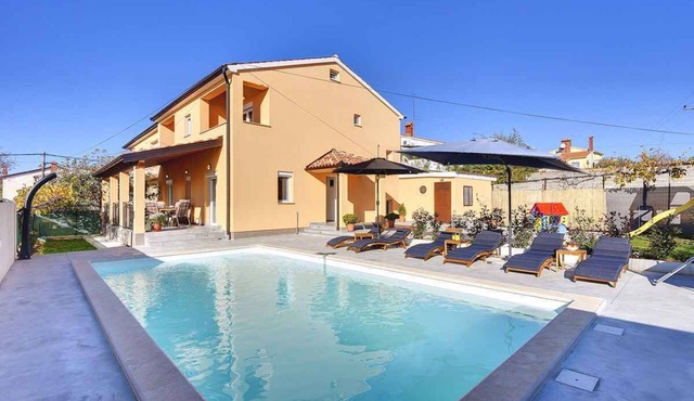 Villa with swimming pool and children's playground