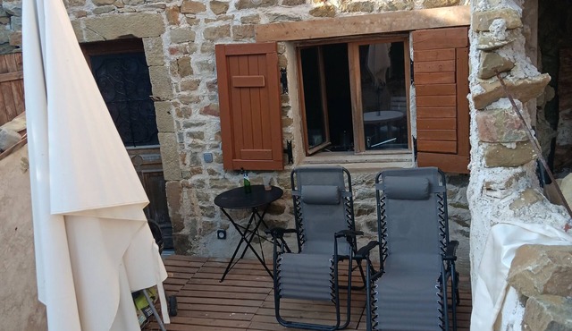 Village house with terrace on pedestrian lane. Cluniac village.