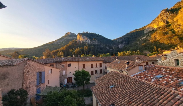 Village house at the foot of the cliffs
