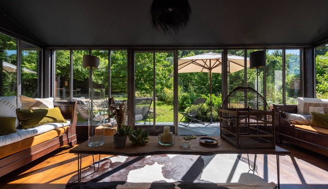 Village house with garden, on the banks of a river in a listed village