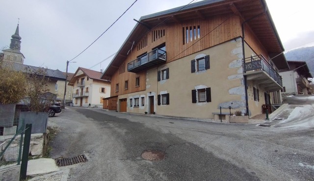 Villard in the heart of the green valley between lake and mountains