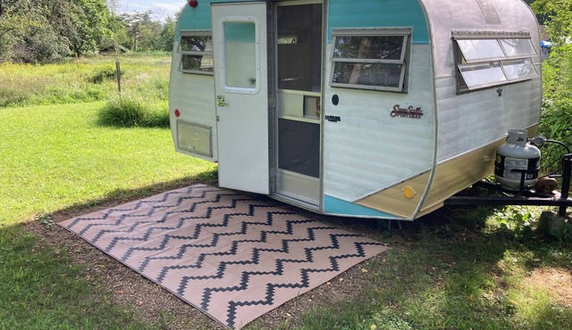 Vintage camper on small farm