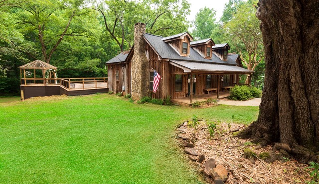 Vintage charm meets modern comfort in this historic 1850s cabin at Lake Hartwell