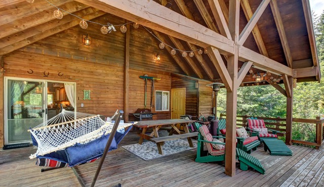 Vintage dog-friendly riverfront cabin with covered deck & fireplace - near lake