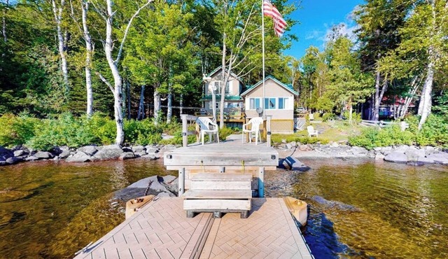 Vintage lakefront cabin with incredible water views, private dock & pebble beach