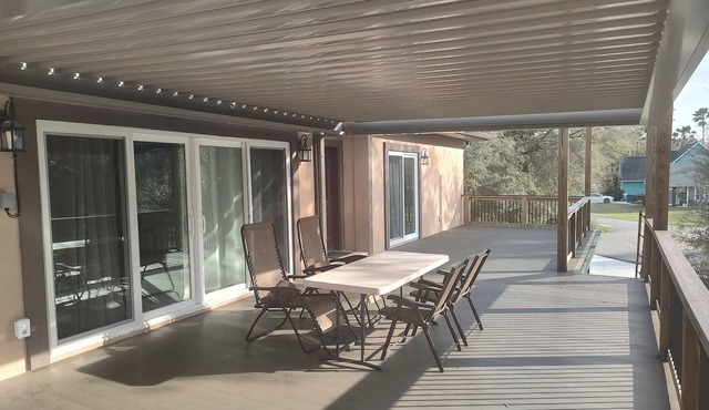 Walk to the beach. Two room suite & shaded deck with sunset views over greenway.
