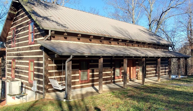 Walk to the water log cabin, access to dock, hot tub, fire pit, grill, spacious